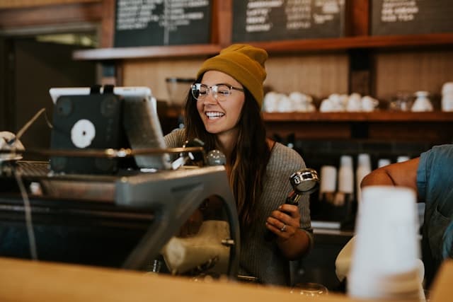 a barrister brewing a coffee drink